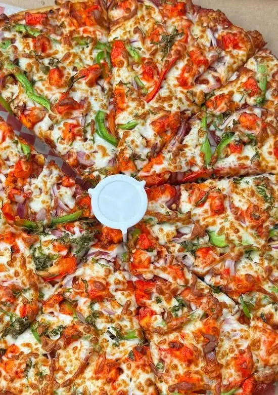 Delicious Tandoori Paneer Twist Pizza at Freshco in Edmonton, AB